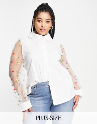 Plus-size blouse by Never Fully Dressed Waist-up dressing Spread collar Button placket Textured sleeves with floral embroidery Frill cuffs Regular fit