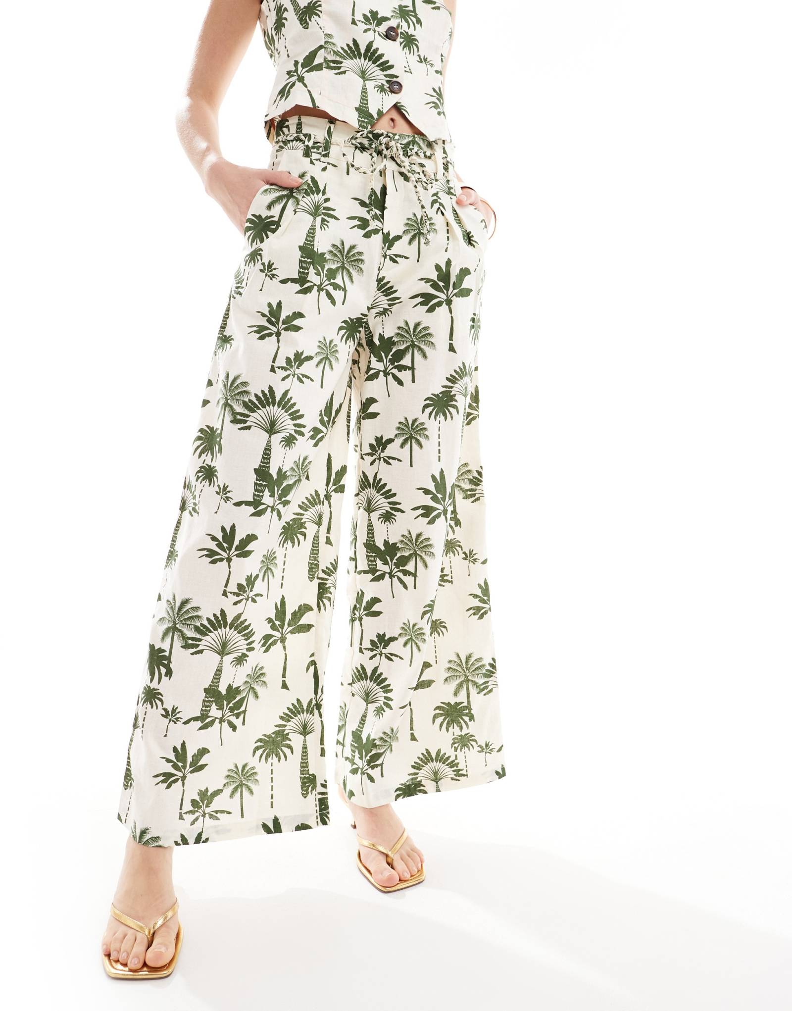 Никогда не надевавшиеся полностью брюки Rhea с зеленым принтом в виде ладони - часть комплекта 21190₽