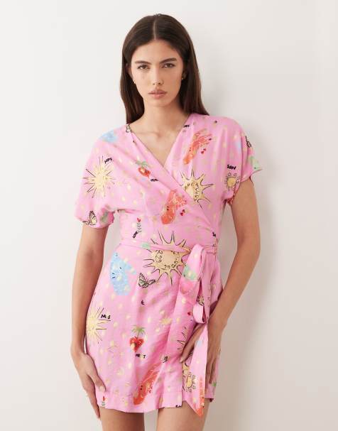 Never Fully Dressed short sleeve tie detail wrap mini dress in pink celestial print - view 1