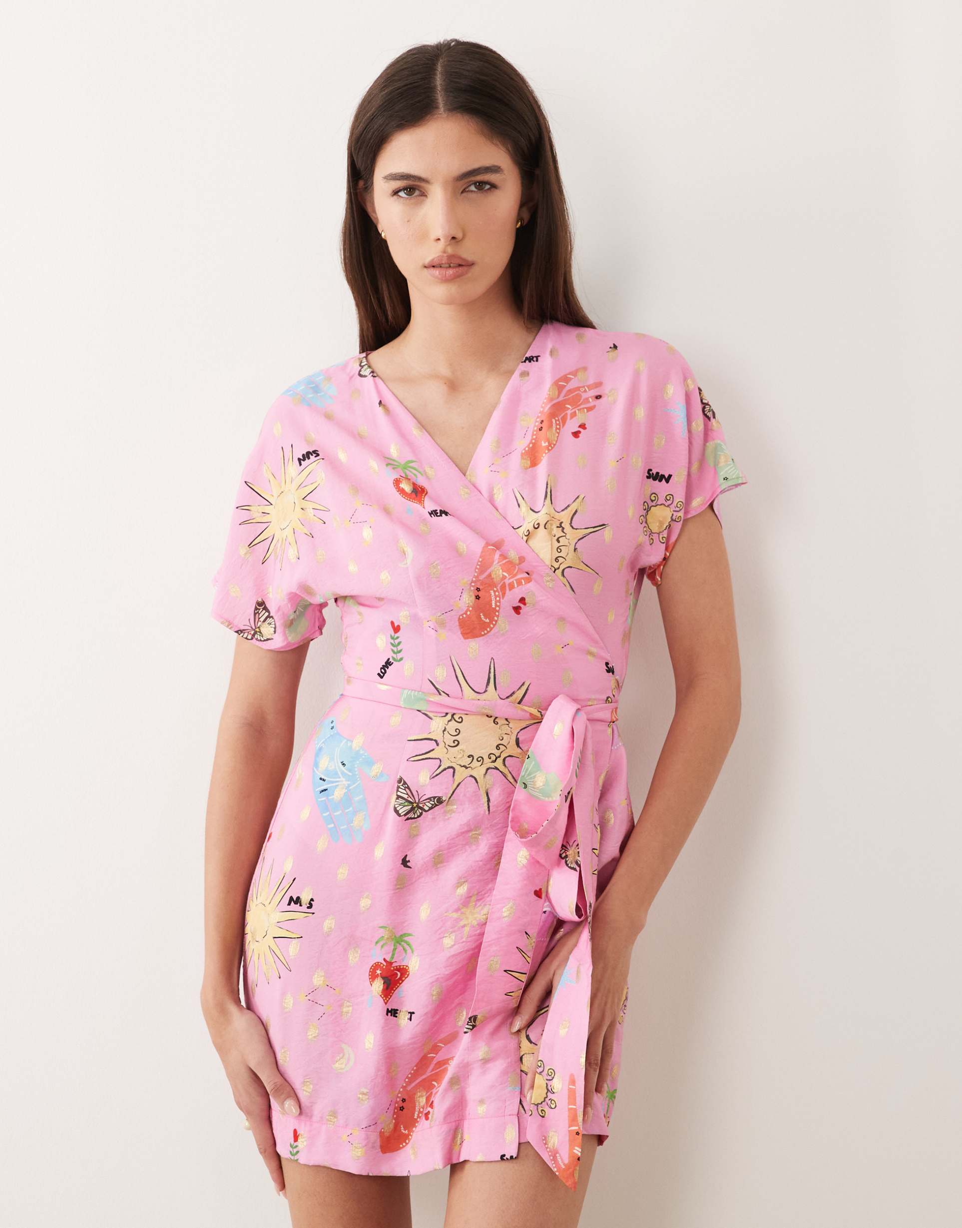 never fully dressed short sleeve tie detail wrap mini dress in pink celestial print