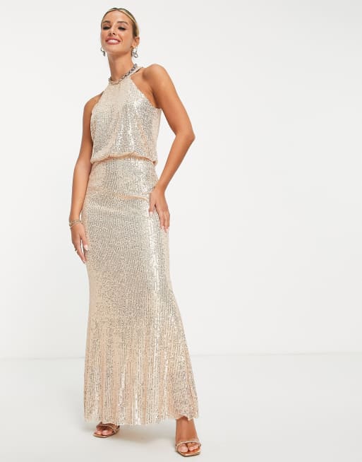 Never Fully Dressed – Vogue – Cekinowa sukienka maxi w kolorze różowego złota