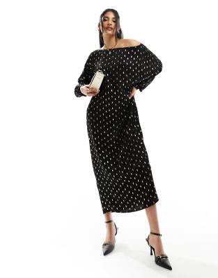 Never Fully Dressed - Wadenlanges Oversize-Kleid in Schwarz mit goldenem Tupfenmuster