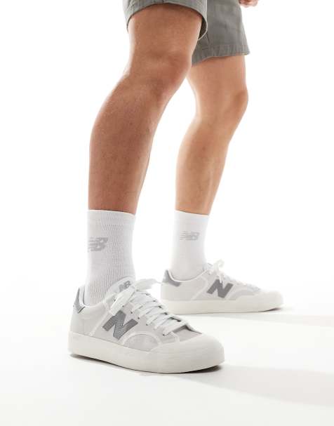 New Balance 100 trainers in white and grey - view 1