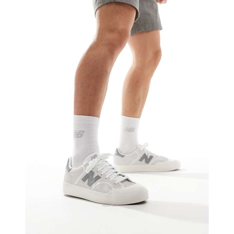 New Balance 100 trainers in white and grey ASOS