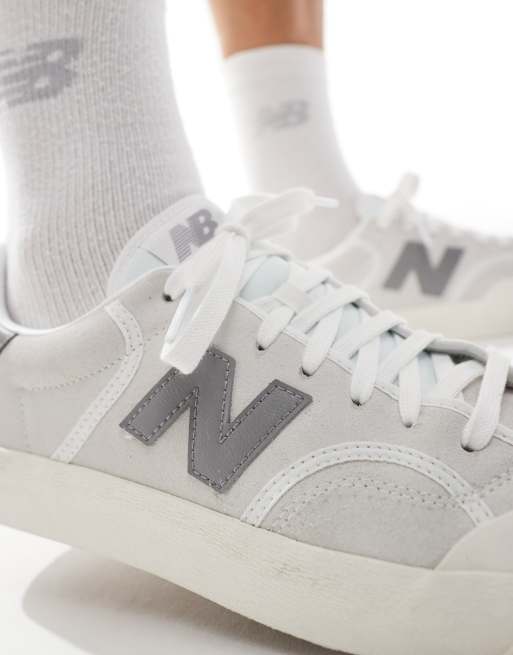New Balance 100 trainers in white and grey ASOS