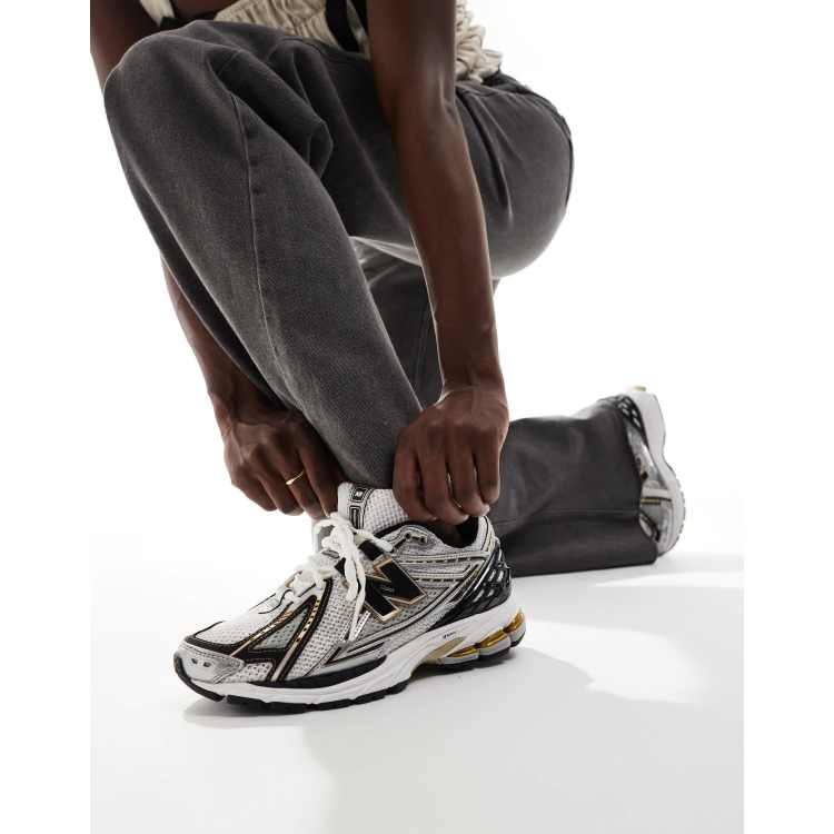 New Balance 1906 sneakers in gold and black | ASOS