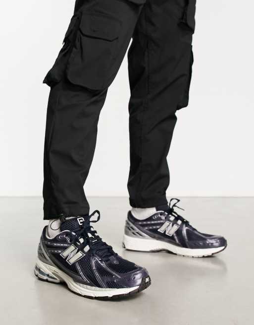New Balance 1906 sneakers in navy with silver detail 