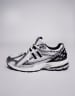 New Balance 1906 sneakers in white with blue and pink details