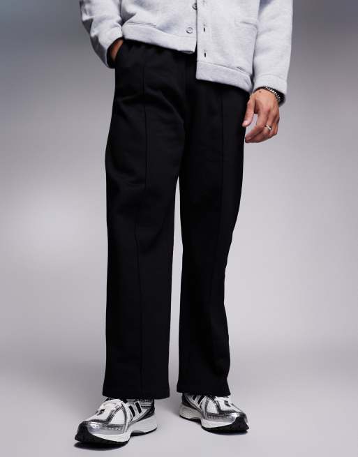 New Balance 1906 sneakers in white with black and silver details