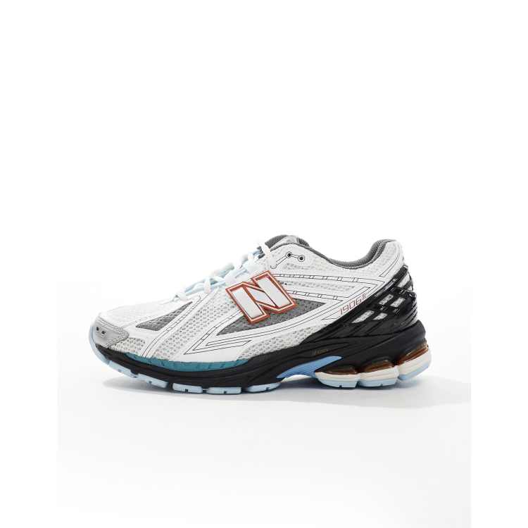 New Balance 1906 sneakers in white with blue and orange