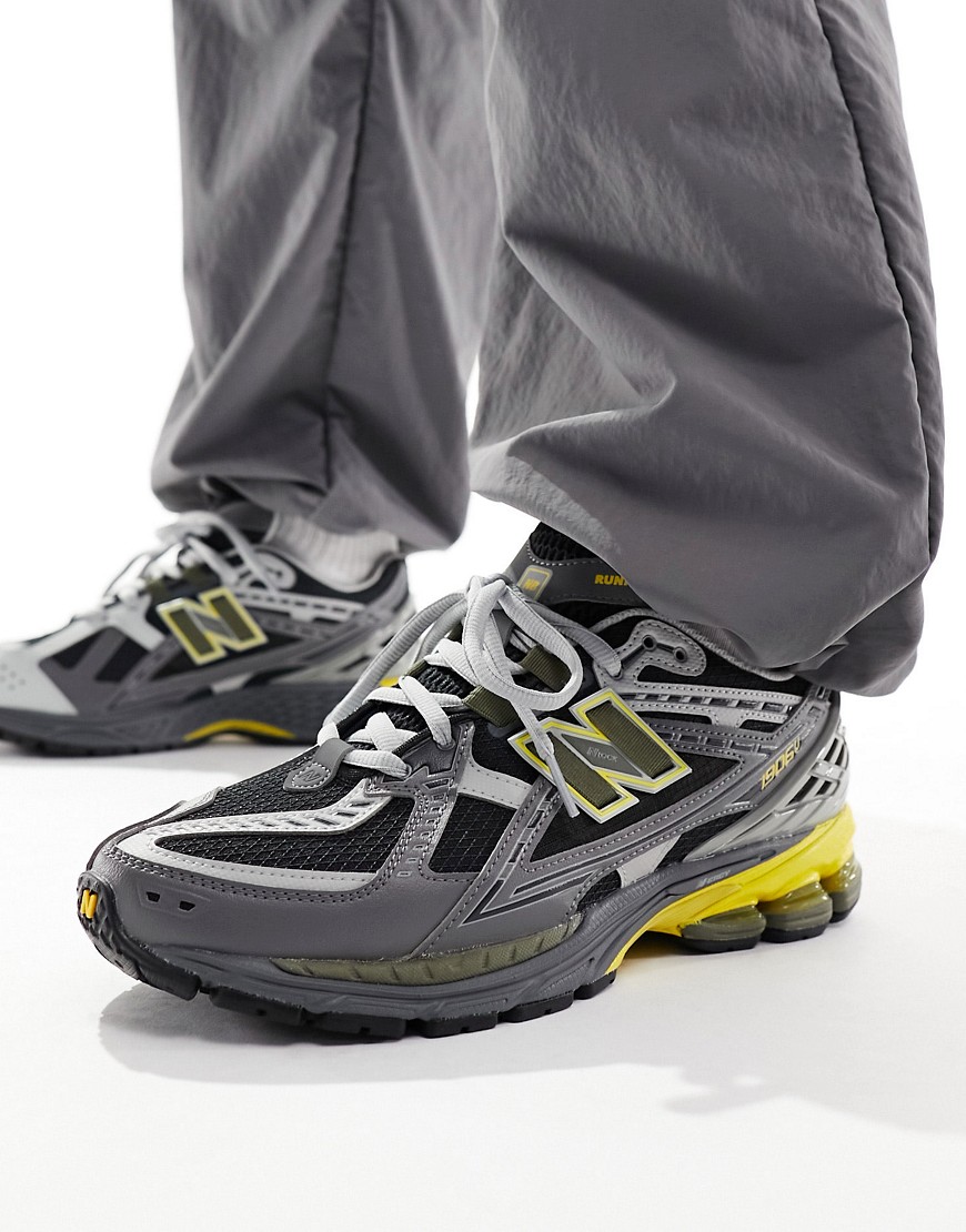 New Balance 1906 trainers in dark grey and yellow