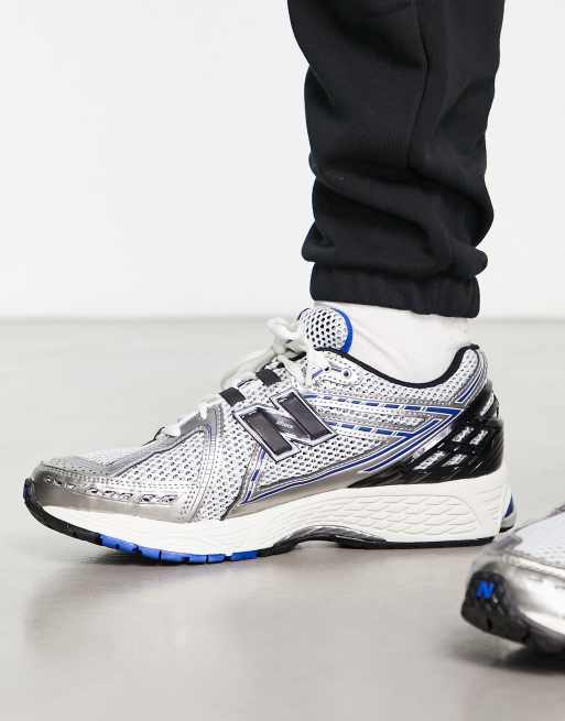 New Balance 1906 trainers in white metallic and blue with black