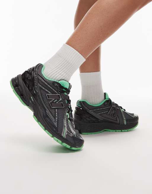 New Balance 1906r trainers in black and green