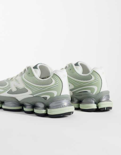 New Balance 2000 trainers in light green, 2 of 5