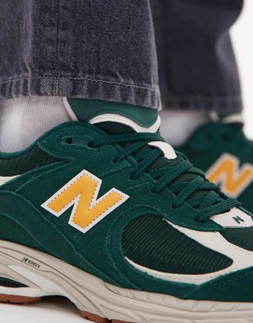 New Balance 2002 collegiate sneakers in green and gold Exclusive