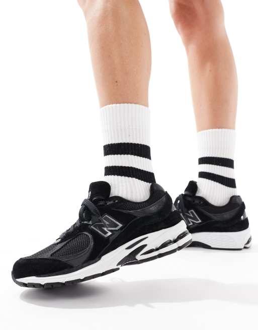 New Balance 2002 sneakers in black and white