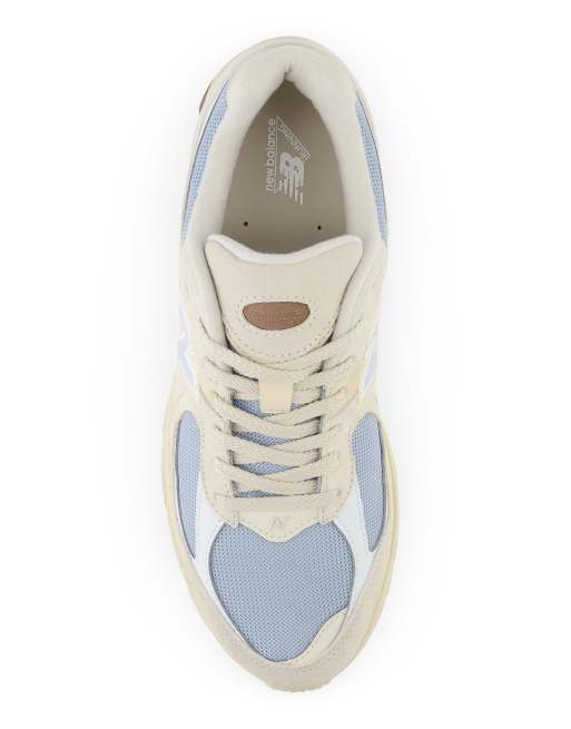 New Balance 2002 sneakers in off white and blue
