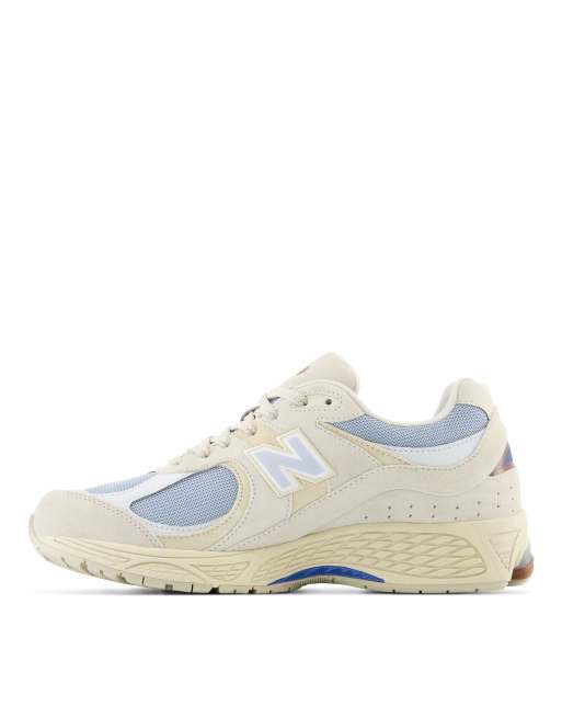 New Balance 2002 sneakers in off white and blue