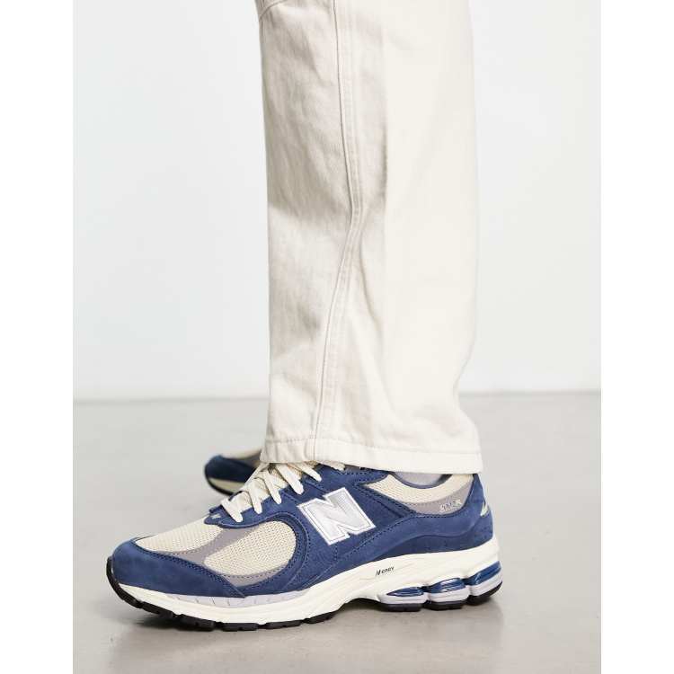 New Balance 2002 trainers in blue and off white