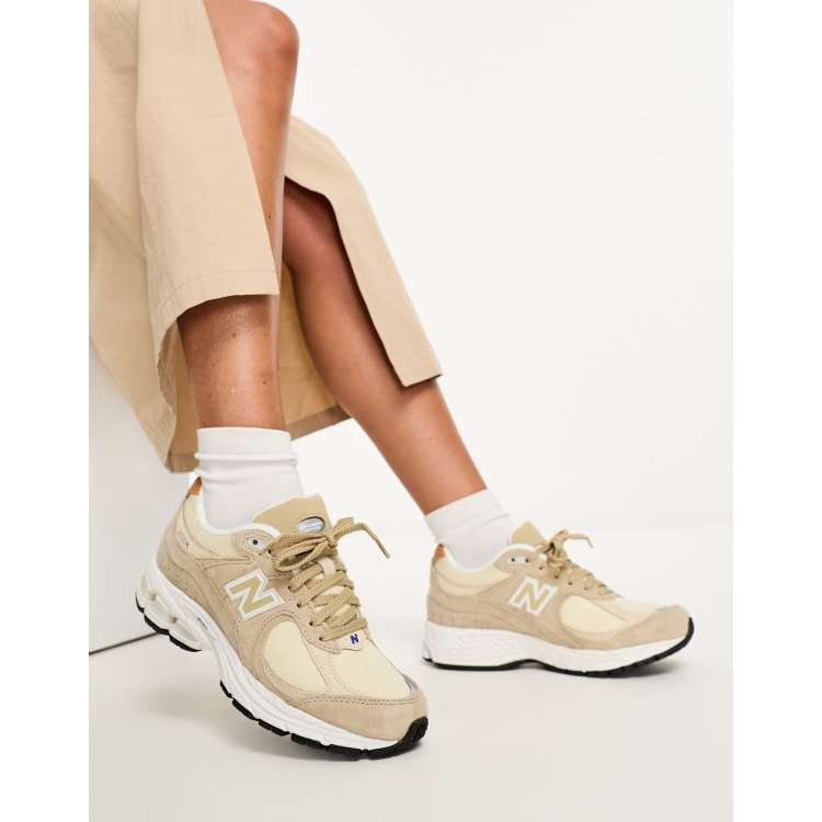 New balance store tan trainers