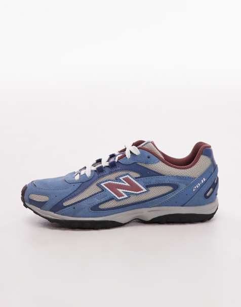 New Balance – 204L – Grå och blå träningsskor i unisex-modell och mocka - view 1