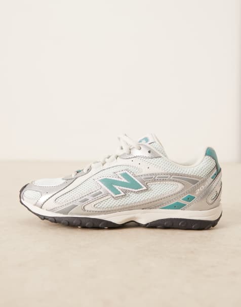 New Balance – 204L – Silvermetalliska och blå träningsskor - view 1