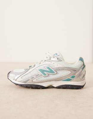 New Balance 204L trainers in silver metallic and blue
