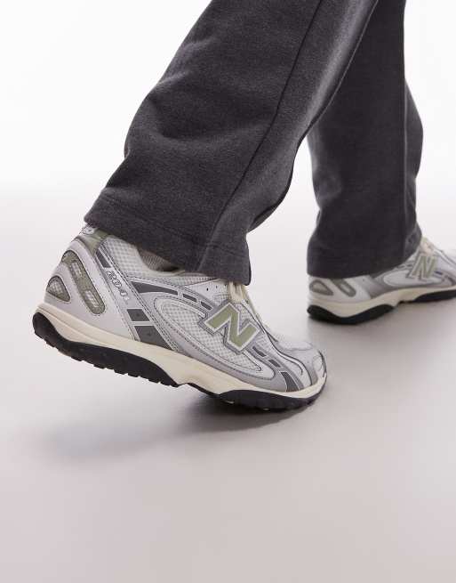 New Balance 204L unisex trainers in white and green | ASOS