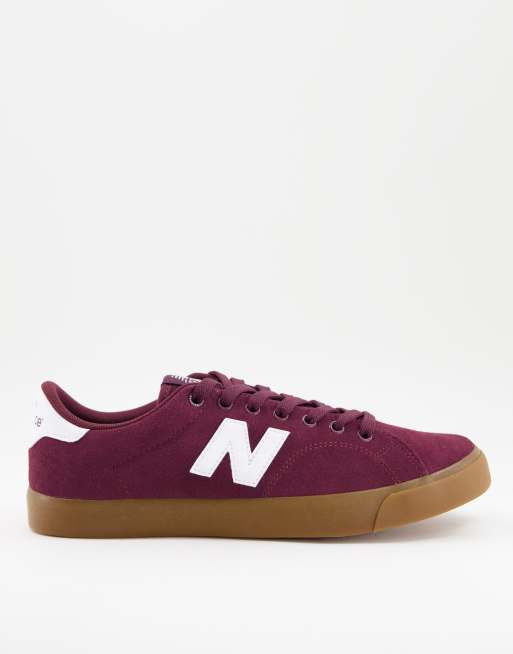 New Balance 210 sneakers in burgundy