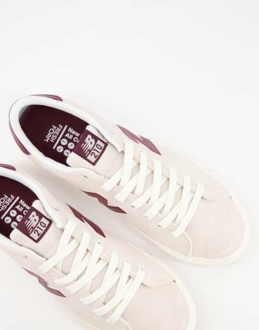 New Balance 210 sneakers in white ASOS