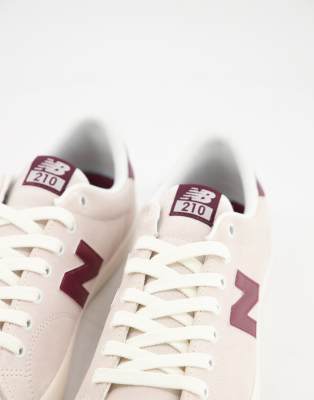 new balance 210 trainers in white with gum sole