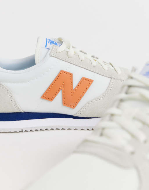 New Balance 220 cream and orange sneakers