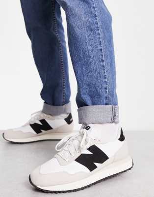 New Balance 237 sneakers in white and black