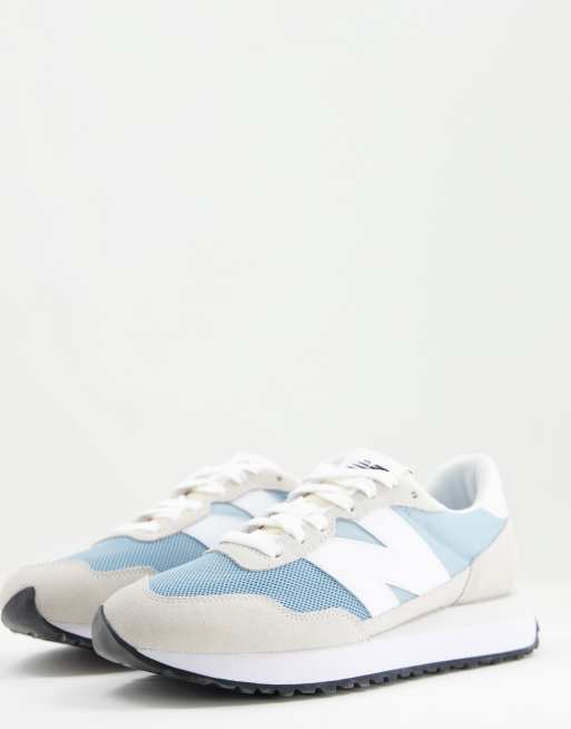 New Balance 237 sneakers in white and blue