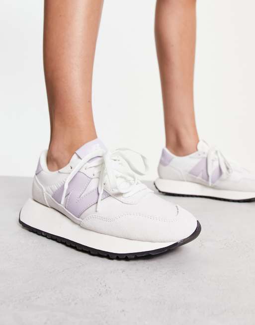 New Balance 237 sneakers in white and lilac