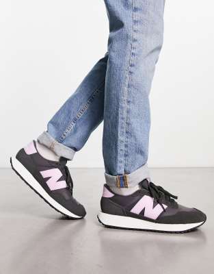 New Balance 237 trainers in black and purple