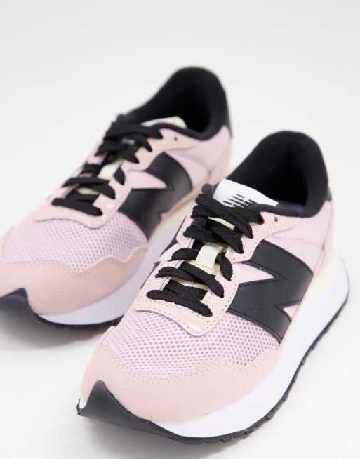 Black and pink shop new balance trainers