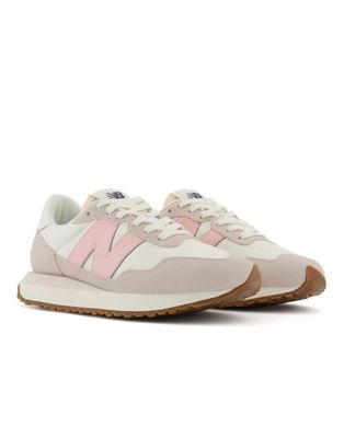 New Balance 237 trainers in white and pastel pink