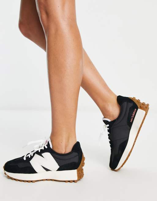 New Balance 327 sneakers in black with gum sole