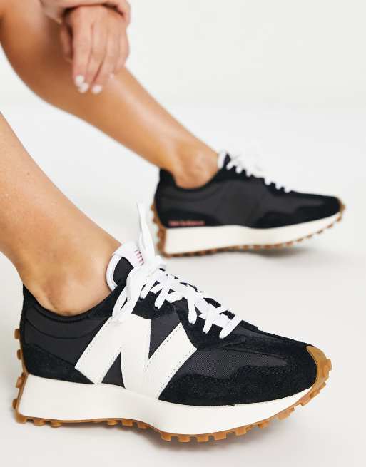 New Balance 327 sneakers in black with gum sole
