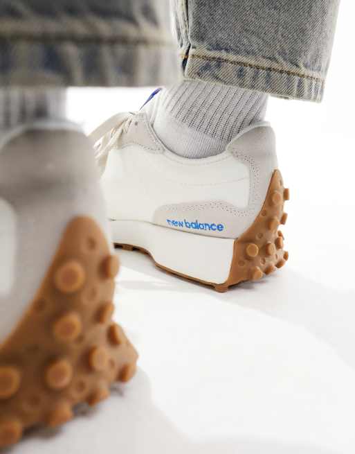 New Balance 327 sneakers in white with blue detail
