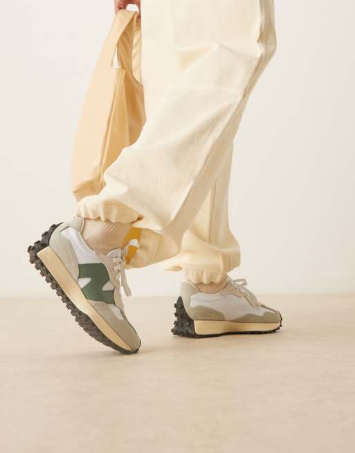 New Balance 327 sneakers in white with light and dark green details