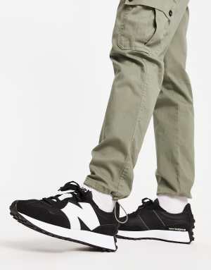 New Balance 327 trainers in black and white