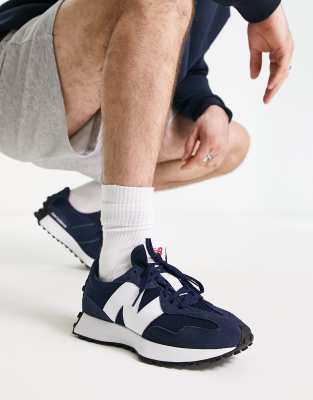 New Balance 327 trainers in blue and white