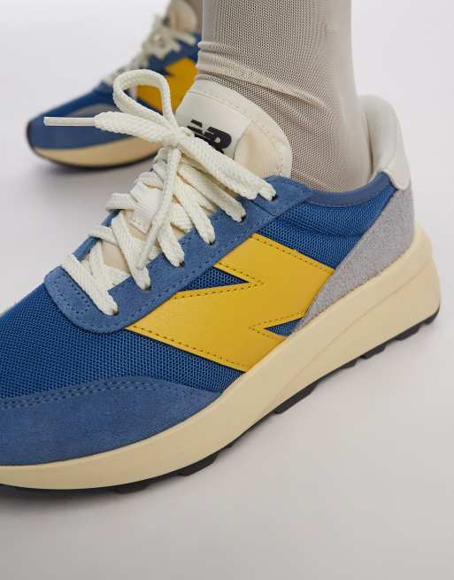 New Balance 370 Sneakers in blauw en geel