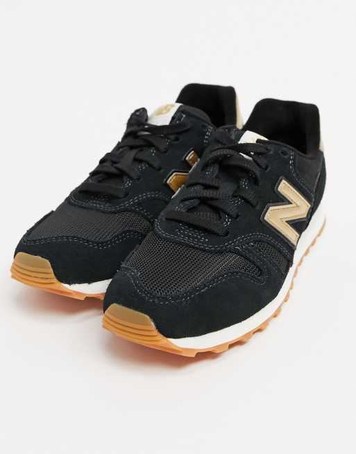 New Balance 373 Baskets Noir et dor