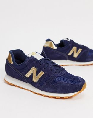 New Balance - 373 - Sneakers blu navy e oro | ASOS