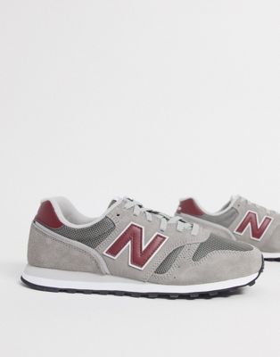 New Balance - 373 - Sneakers grigie e rosse | ASOS