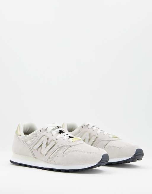 New Balance - 373 - Sneakers i havrefarve og guldfarve