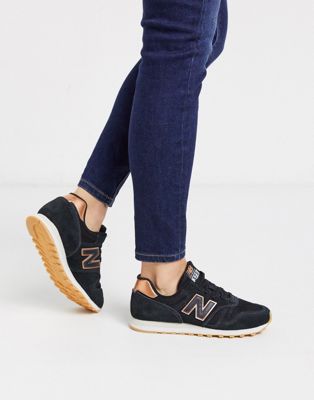 New Balance 373 sneakers in black and rose gold | ASOS